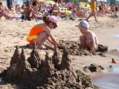 Answer sandcastle,sunbathing,tide